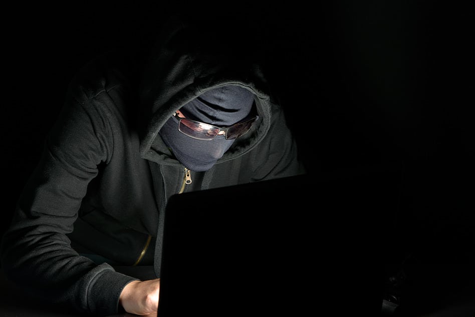 hacker with a hood and black goggles